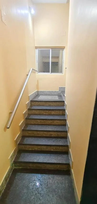 Stairs with a window landing, lit and clean