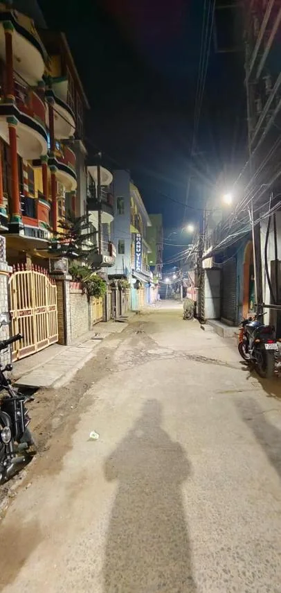 The quiet lane in Swargadwar outside the hotel at night